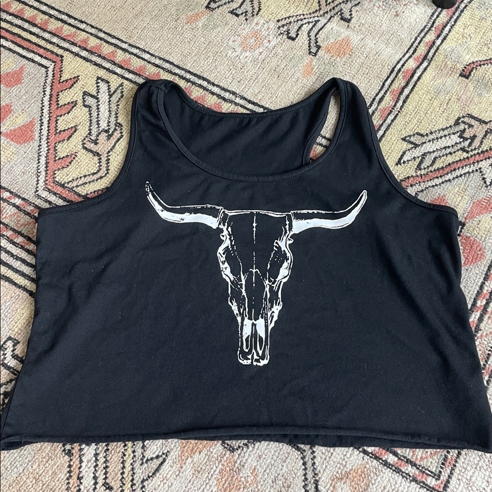 Cowgirl Crop Top with loose fit, rolled hem and bull skull design.